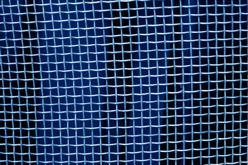 Metal mesh grid pattern in navy blue tone.