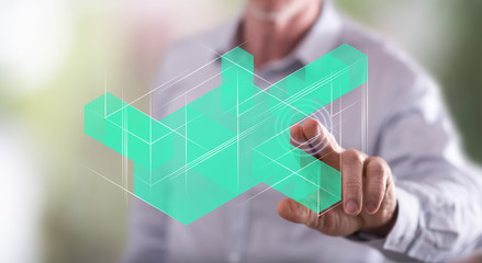 Man touching a blockchain technology concept on a touch screen