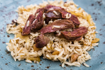 delicious pilaf on a blue plate