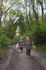 Children run along the forest road