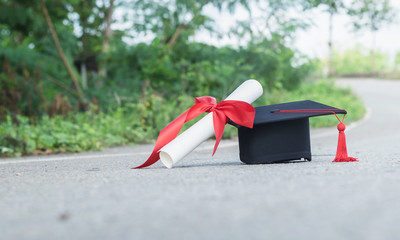 graduate hat and certificated on ground floor
