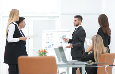businessman makes a presentation to his business team