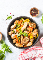 Chicken fried with vegetables.