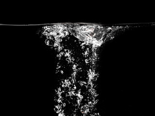 Bubbles of air in water on a black background