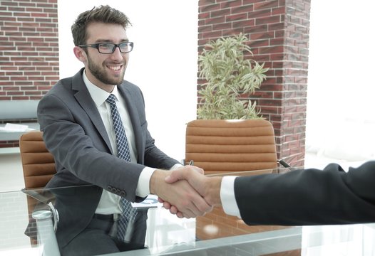 closeup. handshake between the financial Manager and the client