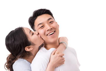 Fototapeta premium Kiss On the Cheek. Woman kissing man on cheek.