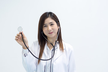 Close up doctor hands holding stethoscope over white background.