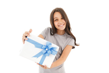 Happy girl standing isolated holding surprise gift box.