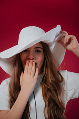 Teenager girl wearing big summer hat.Fashion concept - portrait of a beautiful little girl in big hat