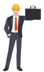 Businessman in construction helmet with hand in pocket holding briefcase