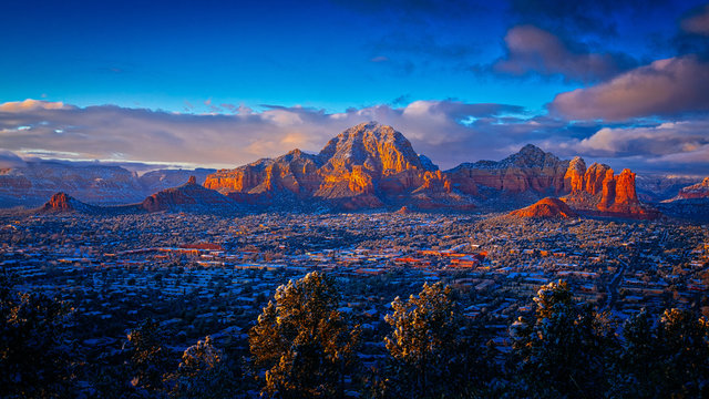 Red Rock Mountain With Snow and City in Foreground