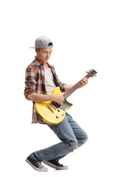Teenager playing an electric guitar