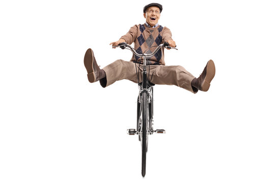 Overjoyed senior riding a bicycle