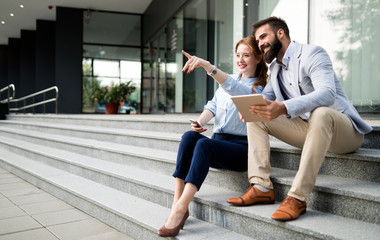 Picture of handsome businessman and attractive businesswoman