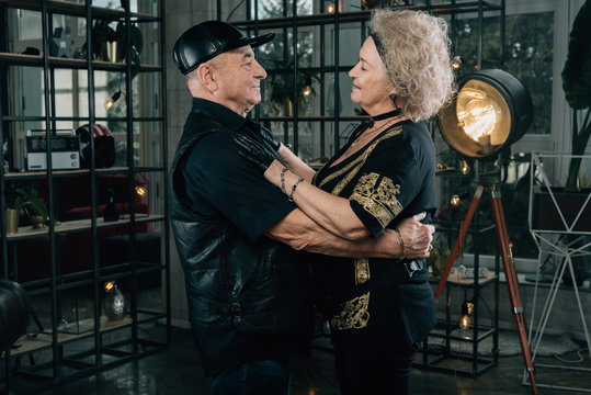 Unusual retired couple.Happy couple of retirees in biker clothes.Biker grandmother and biker grandfather. Biker couple.Happy pensioners