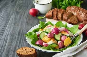 Vegetable salad with baked radish and potatoes