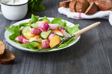Vegetable salad with baked radish and potatoes