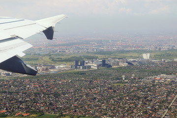 Take off from Copenhagen airport, aerial view of the city neighborhood