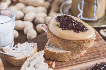 Peanut Butter and Jelly Sandwich on Rustic Wooden Cutting Board