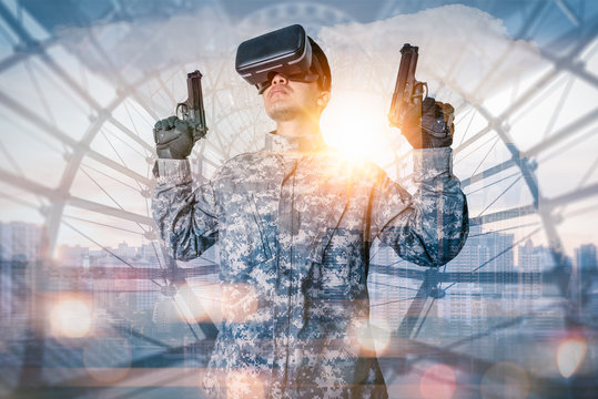 The double exposure image of the soldier hold the guns during sunrise overlay with cityscape image. the concept of virtual hologram, simulation, gaming, internet of things and future life.