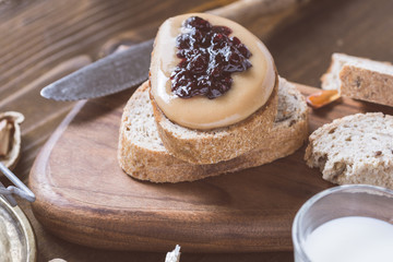 Peanut Butter and Jelly Sandwich on Rustic Wooden Cutting Board