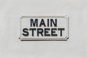 Main Street sign on a white wall in the British overseas territory of Gibraltar