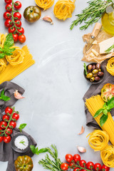 Italian food ingredients with pasta, tomatoes, cheese, olive oil, basil