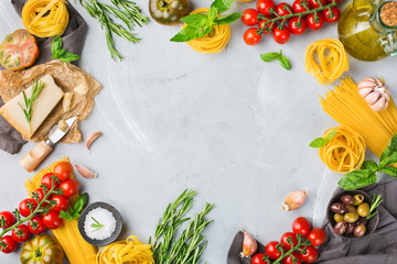 Italian food ingredients with pasta, tomatoes, cheese, olive oil, basil
