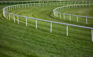 Foto auf Acrylglas Reiten horse race track railing barrier turn