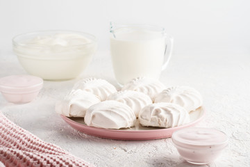 Obraz na płótnie Canvas Protein products ingredients for breakfast marshmallows sour cream yogurt milk piece of bread green tea