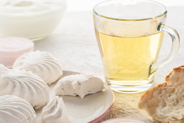 Protein products ingredients for breakfast marshmallows sour cream yogurt milk piece of bread green tea