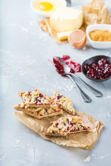 Homemade cake cookie bars with berry jam and ingredients