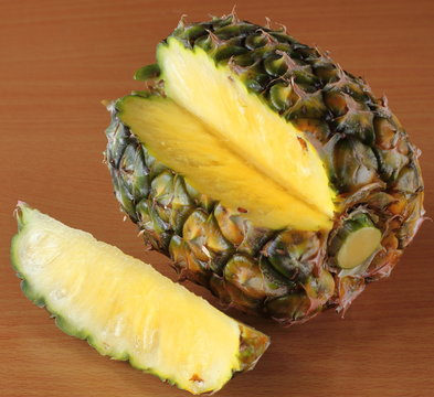 One whole sweet pineapple with green leaves