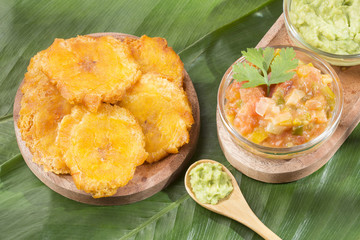 Patacón fried flattened pieces of green plantain (tostón, tachino)