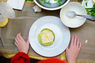 process of preparation of salad by the child at school of young cooks