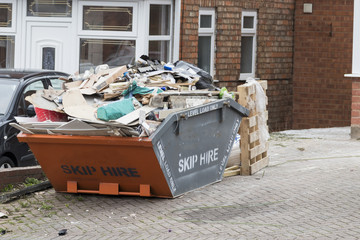 Street side skip filled with rubish