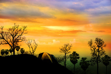 Beautiful mountain scenery with sunset and tourist tents