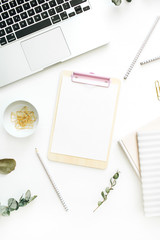 Flat lay office workspace with blank clipboard, laptop and stationery on white background. Top view minimal mock up template concept.