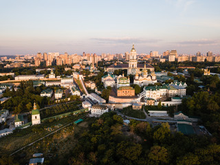 Fototapeta na wymiar Aerial top view of Kiev Pechersk Lavra churches on hills from above, cityscape of Kyiv city