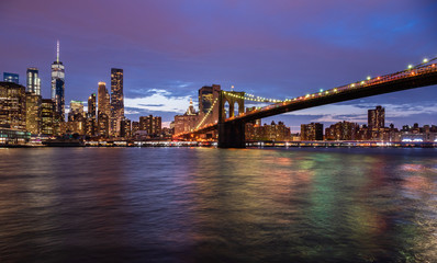 Fototapeta na wymiar New York city USA. Sunset over Manhattan and Brooklyn bridge