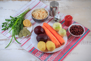 Products on a table on a napkin. Ingredients for borsch.