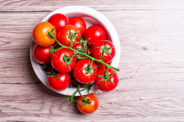 ripe tomatoes on a wooden table