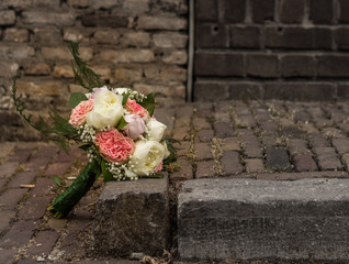 brides bouquet or wedding flowers on a street - 207932438