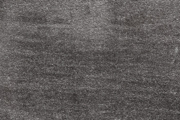 Fototapeta premium Asphalt with fine grain texture. Close-up of road background in black and white color. Top view of the rough surface