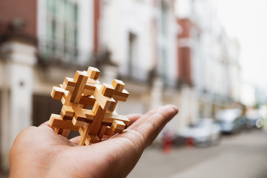 Wooden interlocking on hand using as business and education concept