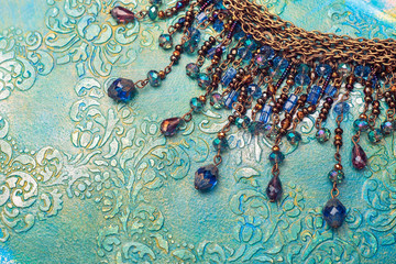 Vintage shabby chic necklace jewelry on acrylic embossed background, acrylic painting, fashion, abstract stylish jewelry