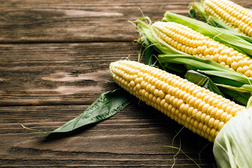 corn cob, wooden background, top view, agriculture
