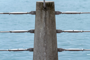detail of modern steel cable fences, stainless steel cable railing systems by the river or lake