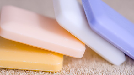 four bars of soap on a towel