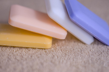 four bars of soap on a towel